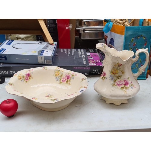 344 - A lovely pottery wash jug and basin with attractive crazing throughout and featuring floral motifs p... 