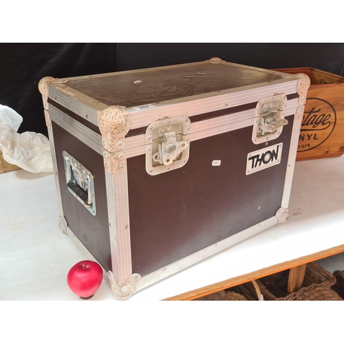 357 - A Thon transport flight  case with two butterfly latches, two folding handles, steel ball corners, a... 