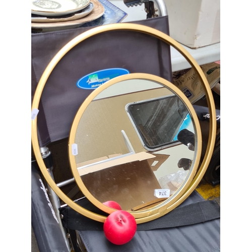 374 - A nice circular double infinity mirror, housed in a gold toned stylish frame. Brand new from a top U... 