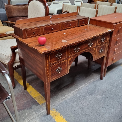 377 - Star lot : A rather striking Regency style kneehole  writing desk boasting string inlay to writing s... 