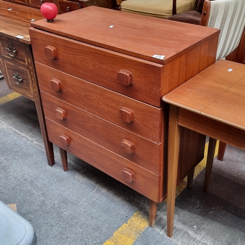 379 - Star Lot : A wonderful teak mid century footed chest of drawers, with four drawers, carved square kn... 