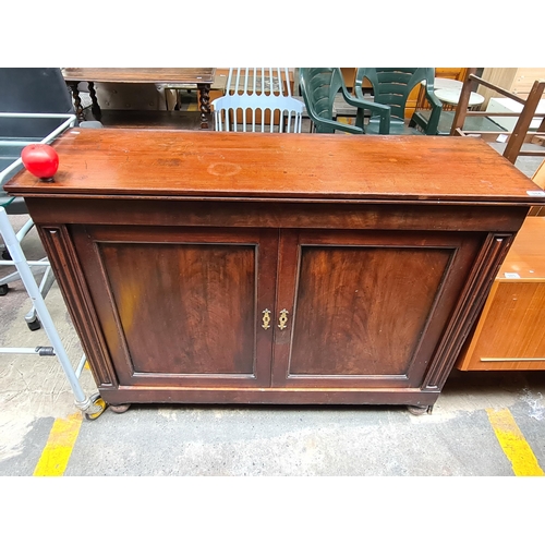 384 - Star Lot : A handsome antique , well made, mahogany footed sideboard. Opens to reveal two interior s... 