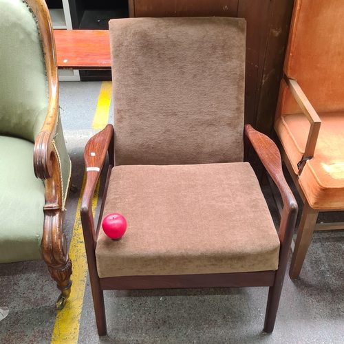 392 - A superb Mid Century Danish  armchair boasting a afromosia teak frame and upholstered chocolate brow... 