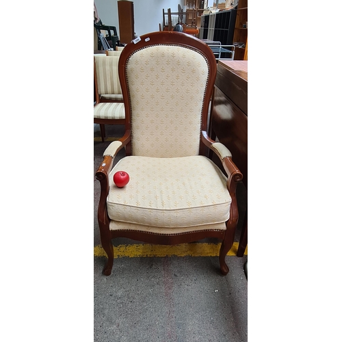 399 - Star Lot : A beautiful  fireside armchair with balloon back, cabriole legs, in a cream modern damask... 