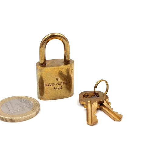 16 - An original Louis Vuitton Paris brass padlock together with two keys.