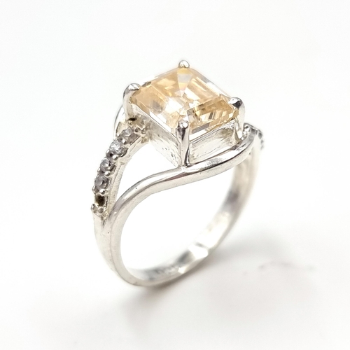 21 - Star Lot : A fabulous golden moissanite gemstone ring together with a diamond set twist mount. Ring ... 