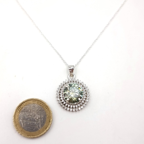 26 - Star lot : A fabulous Oceanic Green Moissanite gemstone pendant with pretty diamond surround. Length... 