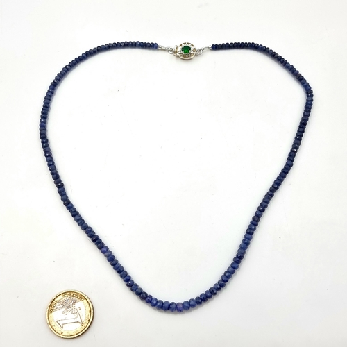 30 - A nice example of a graduated sapphire stone necklace with an emerald and diamond clasp set in sterl... 