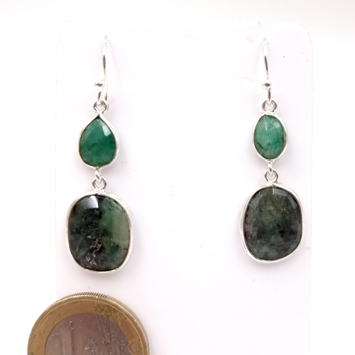 33 - A pair of natural emerald drop pendant earrings suitable for pierced ears. Drop - 3 cms. Weight - 3.... 