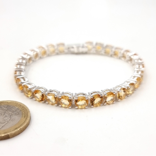 34 - Star Lot : A fabulous 28 finely matched gemstone citrine bracelet set in sterling silver with double... 