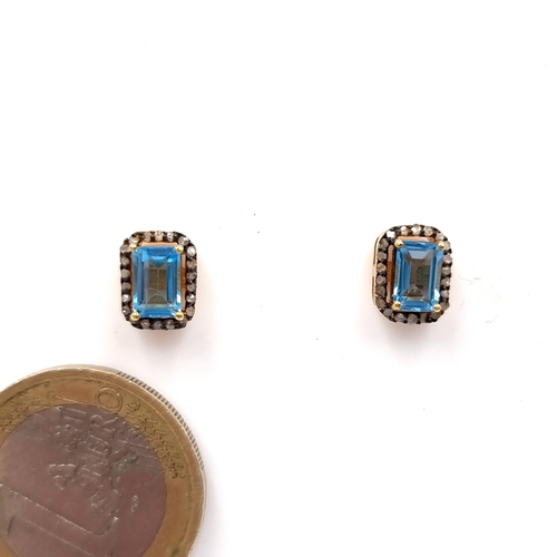 35 - A very nice pair of blue topaz stud earrings set in silver gilt mounts. Weight - 2.95 grams. Brand n... 