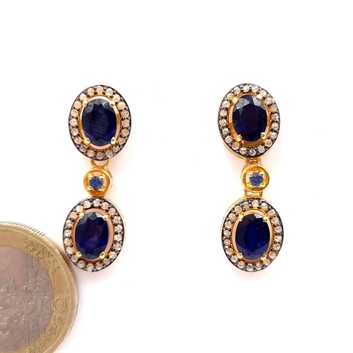 37 - Star Lot :  A pair of super pretty sapphire drop pendant stud earrings with diamond surround set in ... 