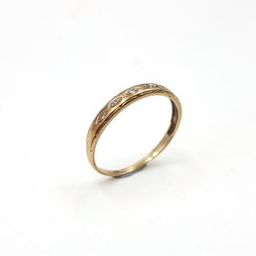 45 - A pretty diamond half eternity ring set in nine carat gold. Ring size - N. Weight is .90 grams.