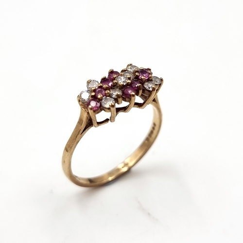 47 - Star Lot : A vintage multi-stone ruby and gem stone ring set in nine carat gold (375). Ring size - N... 