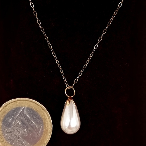 54 - A lustre pearl drop pendant set in nine carat gold with nine carat gold chain. Length - 40 cms. Tota... 