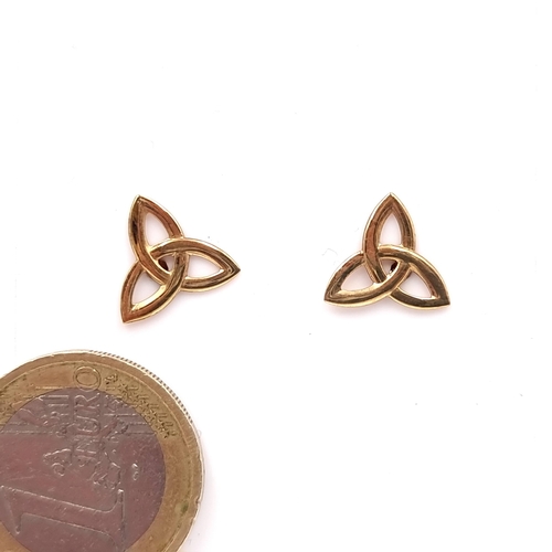 55 - A pair of nine carat gold (375) celtic design stud earrings. Weight - 1 gram. Boxed.