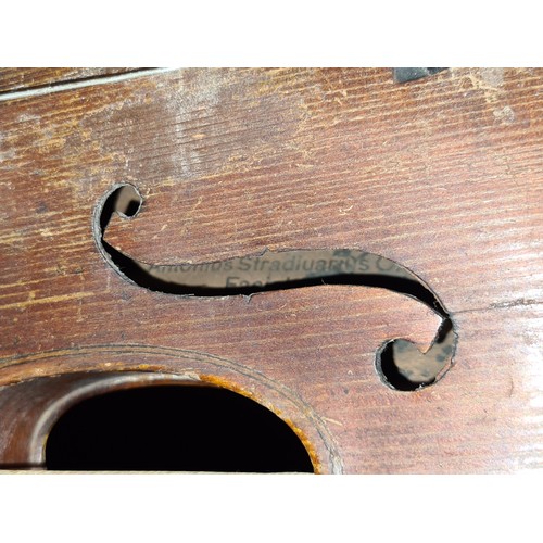 107 - Star Lot : A vintage wooden violin. Labelled Antonius Stradivarius, Cremona 1715 to interior.