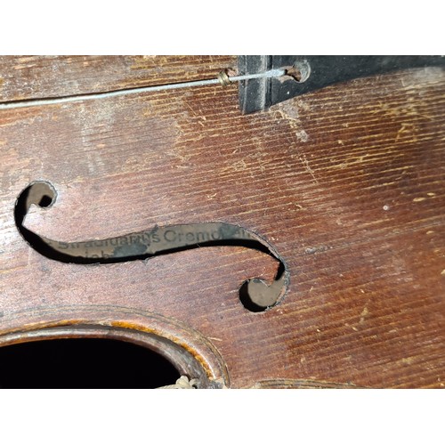 107 - Star Lot : A vintage wooden violin. Labelled Antonius Stradivarius, Cremona 1715 to interior.