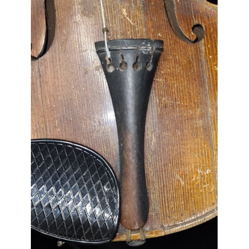 107 - Star Lot : A vintage wooden violin. Labelled Antonius Stradivarius, Cremona 1715 to interior.