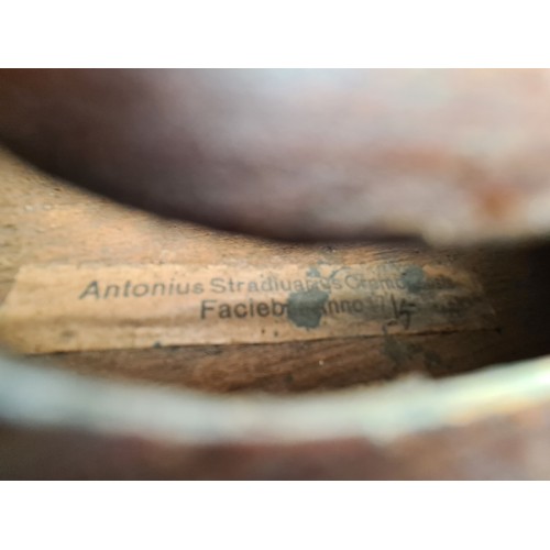 107 - Star Lot : A vintage wooden violin. Labelled Antonius Stradivarius, Cremona 1715 to interior.