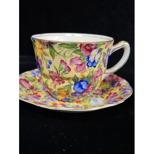 115 - A very pretty, early 20th century, Royal Winton chintz teacup, saucer and side plate. All stamped to... 