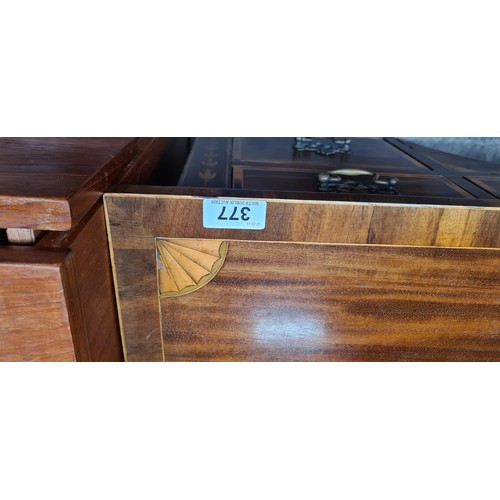 377 - Star lot : A rather striking Regency style kneehole  writing desk boasting string inlay to writing s... 