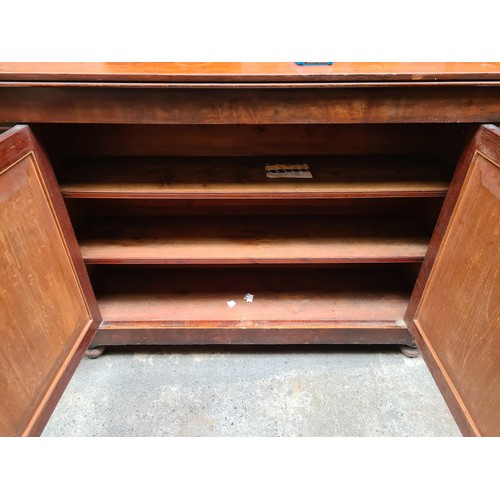 384 - Star Lot : A handsome antique , well made, mahogany footed sideboard. Opens to reveal two interior s... 