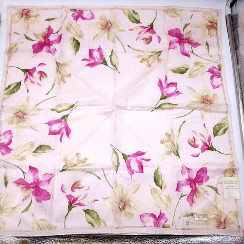 14 - A collection of four designer silk & cotton scarves. Dimensions: 58 cms square. Items as per photogr... 