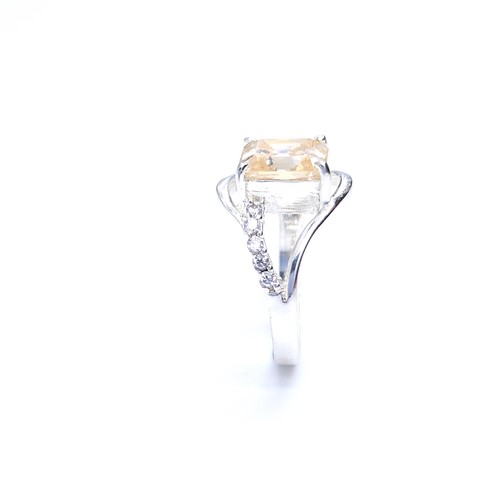 21 - Star Lot : A fabulous golden moissanite gemstone ring together with a diamond set twist mount. Ring ... 