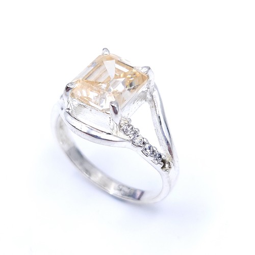 21 - Star Lot : A fabulous golden moissanite gemstone ring together with a diamond set twist mount. Ring ... 