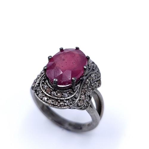 22 - Star Lot : A fabulous example of a large ruby stone ring with claw mount with a diamond surround. Ri... 