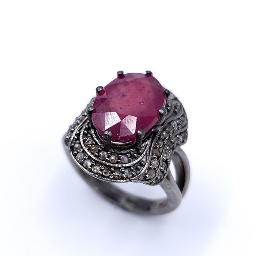 22 - Star Lot : A fabulous example of a large ruby stone ring with claw mount with a diamond surround. Ri... 