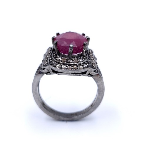 22 - Star Lot : A fabulous example of a large ruby stone ring with claw mount with a diamond surround. Ri... 