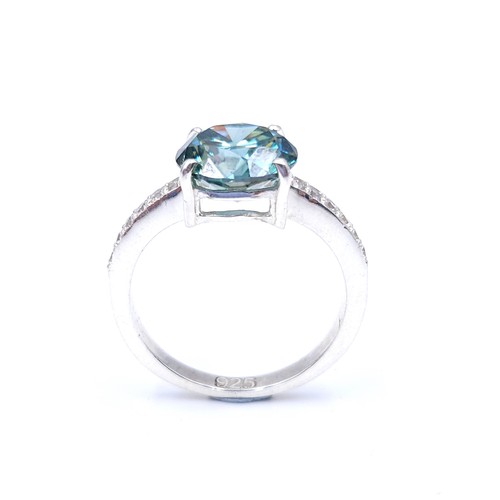 28 - Stunning : An attractive aqua oceanic  green moissanite gemstone set in a claw mount with diamond sh... 