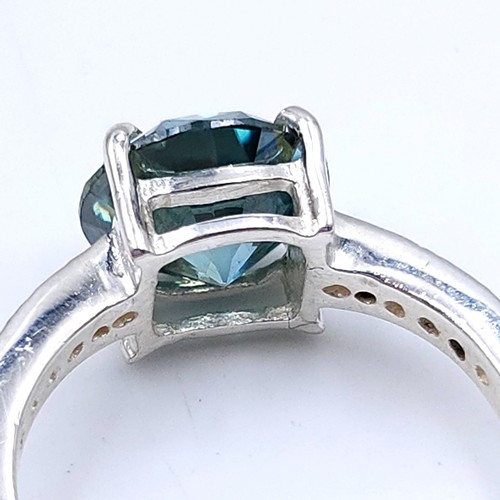 28 - Stunning : An attractive aqua oceanic  green moissanite gemstone set in a claw mount with diamond sh... 