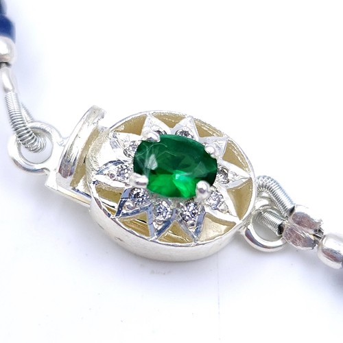 30 - A nice example of a graduated sapphire stone necklace with an emerald and diamond clasp set in sterl... 