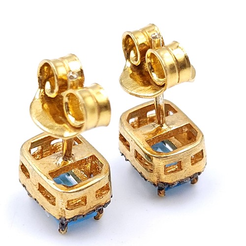 35 - A very nice pair of blue topaz stud earrings set in silver gilt mounts. Weight - 2.95 grams. Brand n... 