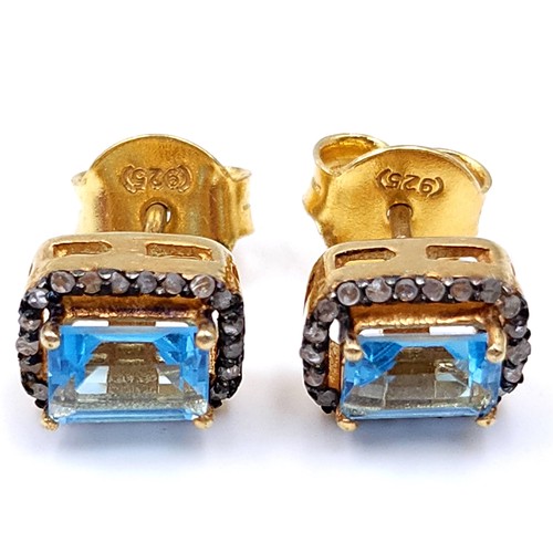 35 - A very nice pair of blue topaz stud earrings set in silver gilt mounts. Weight - 2.95 grams. Brand n... 