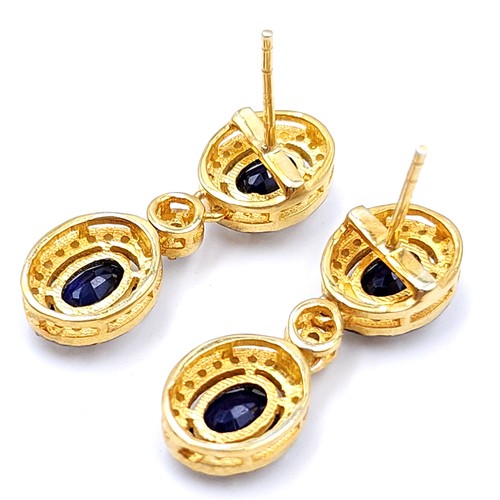 37 - Star Lot :  A pair of super pretty sapphire drop pendant stud earrings with diamond surround set in ... 