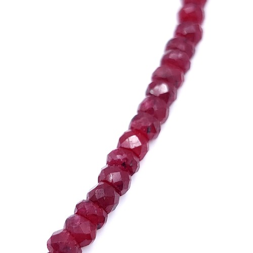 39 - Star lot : An interesting graduated ruby stone necklace set with a sapphire stone mount & surround s... 