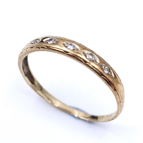 45 - A pretty diamond half eternity ring set in nine carat gold. Ring size - N. Weight is .90 grams.