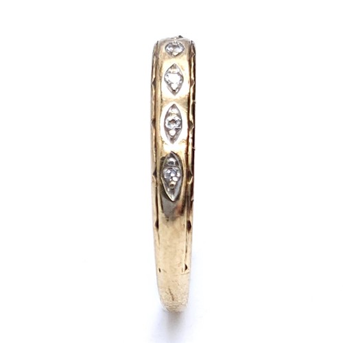 45 - A pretty diamond half eternity ring set in nine carat gold. Ring size - N. Weight is .90 grams.