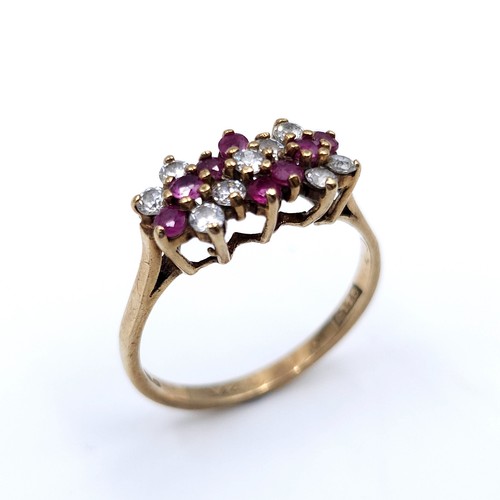 47 - Star Lot : A vintage multi-stone ruby and gem stone ring set in nine carat gold (375). Ring size - N... 