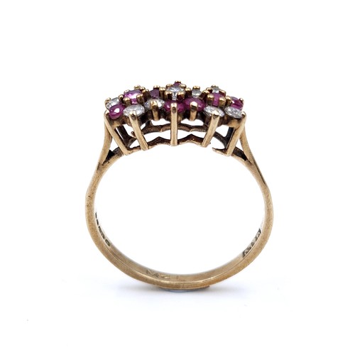 47 - Star Lot : A vintage multi-stone ruby and gem stone ring set in nine carat gold (375). Ring size - N... 