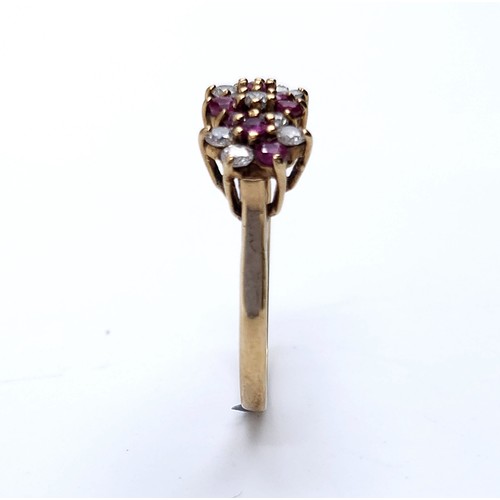 47 - Star Lot : A vintage multi-stone ruby and gem stone ring set in nine carat gold (375). Ring size - N... 