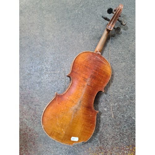 107 - Star Lot : A vintage wooden violin. Labelled Antonius Stradivarius, Cremona 1715 to interior.