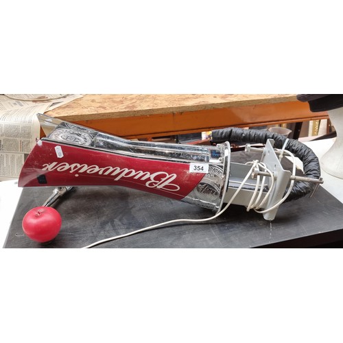 1081 - A Budweiser Beer tap with attachments and branding elements , small damage to the top corner. Previo... 