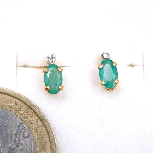 1085 - A pair of nine carat gold Emerald stud earrings. Boxed. Previous in auction 18/08 lot 35