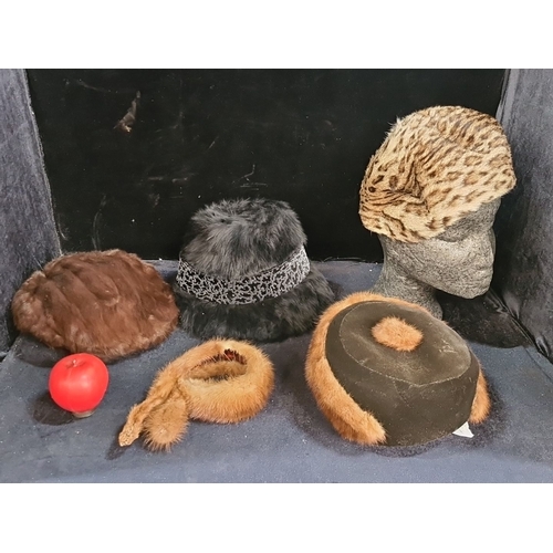 1094 - Collection of five vintage fur hats, including mink and faux leopard print. The collection features ... 