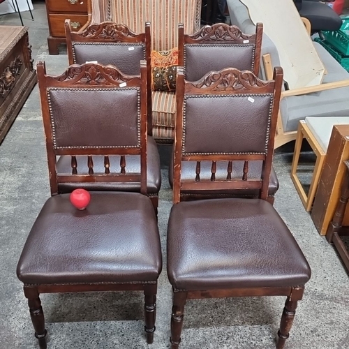 1100 - Set of four Victorian-style dining chairs with carved wooden frames and studded leather upholstery. ... 